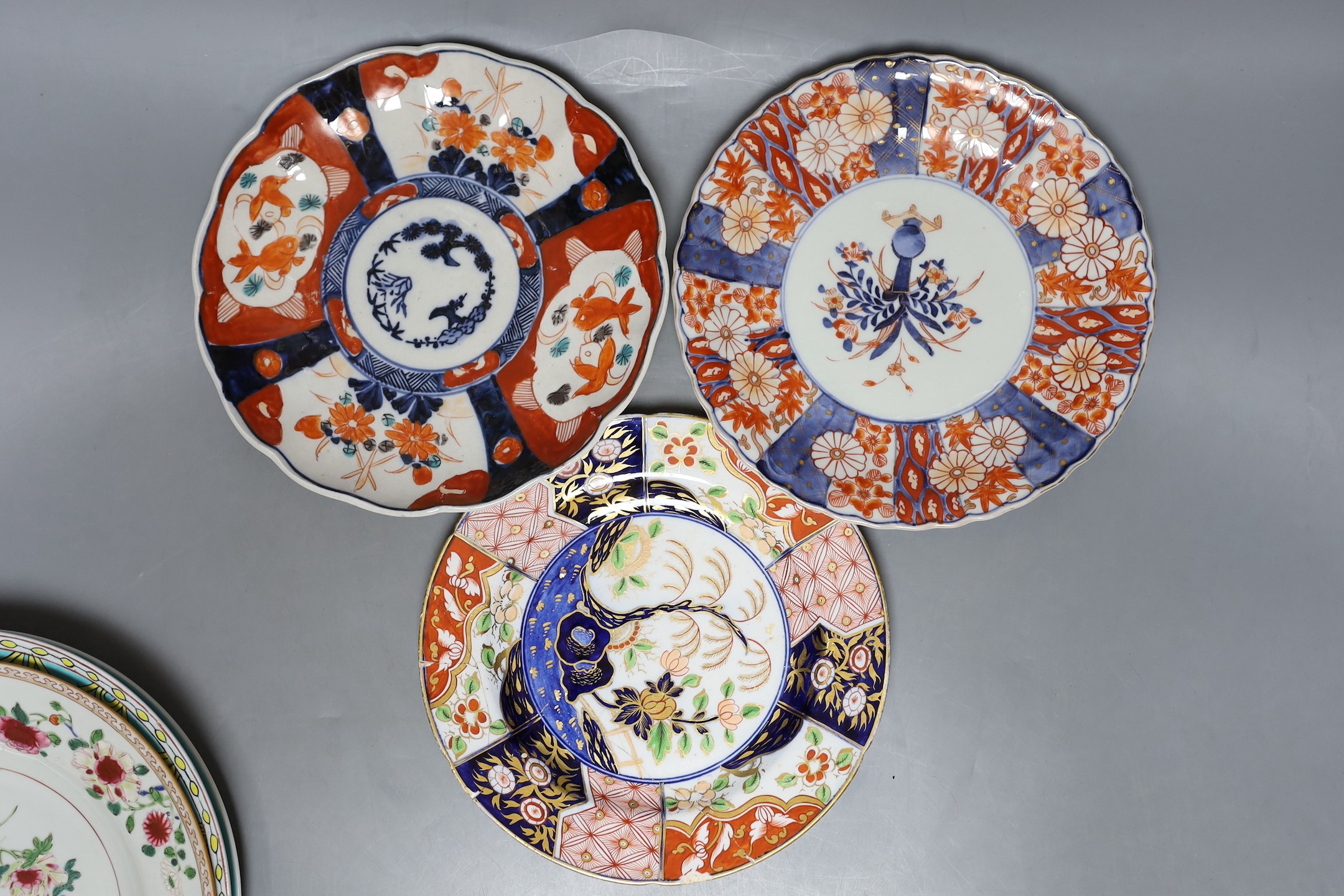 A collection of Chinese 19th and 20th century plates, together with Japanese Imari plates.